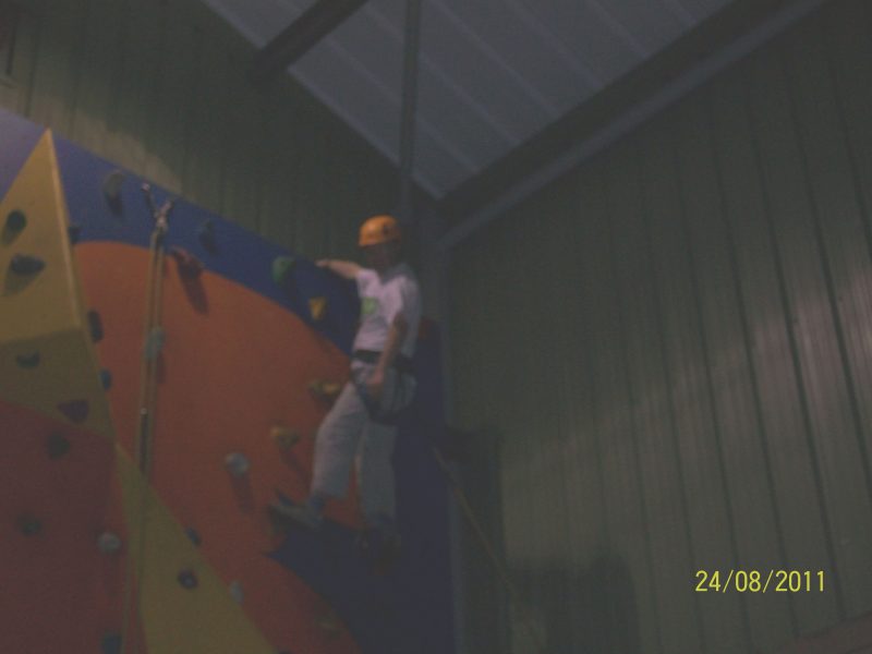 Andrew Lindell at top of wall, Hans Price Gym